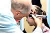 Audiologist helps woman hear...
